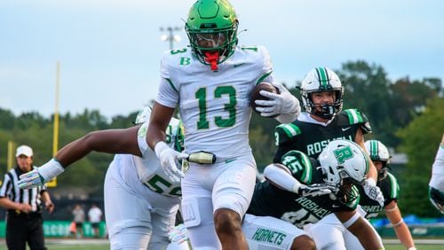 Buford runs the ball in for a touchdown during the Buford at Roswell high school football game in Roswell, Georgia on September 6, 2024. (Jamie Spaar for the Atlanta Journal Constitution)