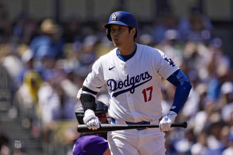 Los Angeles Dodgers' Shohei Ohtani reacts to taking a strike during the first inning of a baseball game against the Colorado Rockies, Sunday, Sept. 22, 2024, in Los Angeles. (AP Photo/Mark J. Terrill)