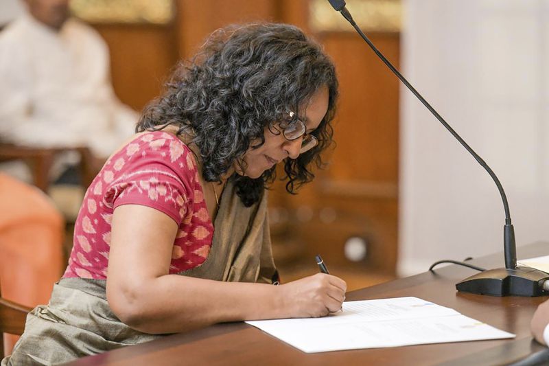 National People's power lawmaker Harini Amarasuriya, 54, signs after taking oath for the post of Sri Lanka's Prime Minister in Colombo, Sri Lanka, Monday, Sept. 23, 2024. (Sri Lanka Government Information Department via AP)