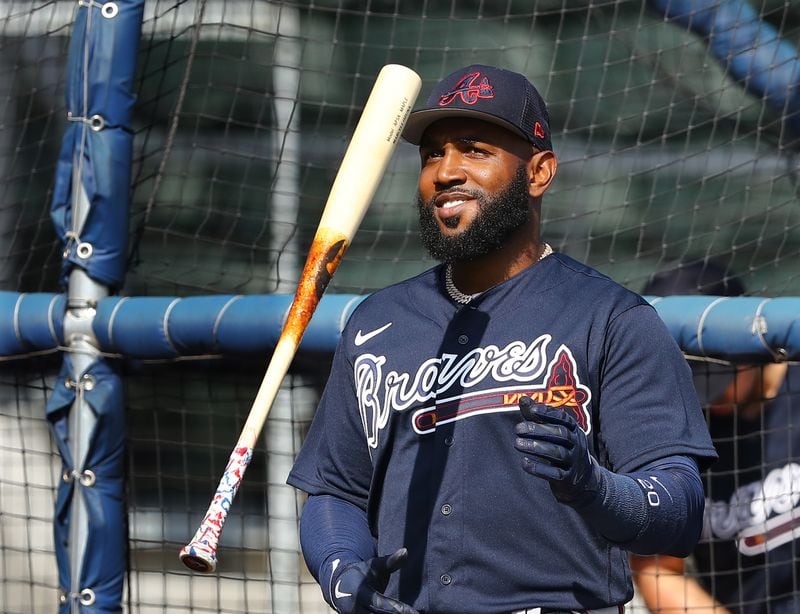 Braves outfielder Marcell Ozuna flips his bat after hitting one over the wall during batting practice at spring training in mid-March in North Port, Fla. Ozuna will try to rebound from a disastrous 2021 season. (Curtis Compton / Curtis.Compton@ajc.com)