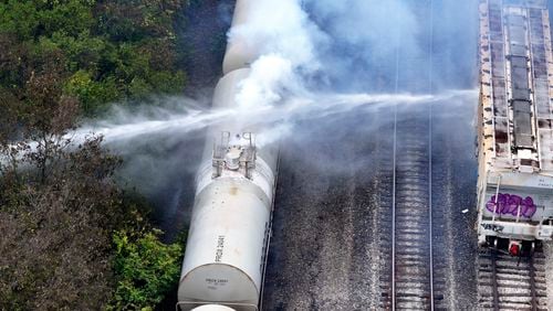 Firefighters work on the scene of a chemical leak in railcars near Cleves, Ohio, Tuesday, Sept. 24, 2024. (Local 12/WKRC via AP)