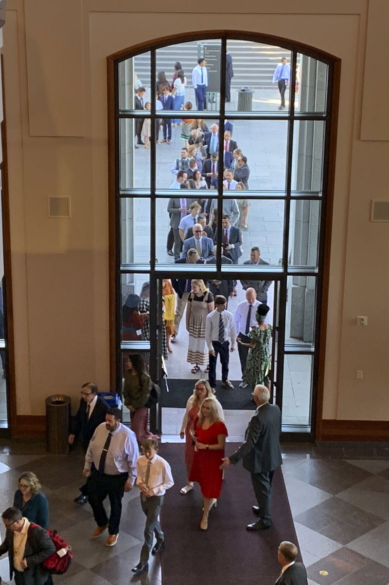 Members of The Church of Jesus Christ of Latter-day Saints file into the church conference center for the faith's twice-annual general conference on Saturday, Oct. 5, 2024, in Salt Lake City, Utah. (AP Photo/Hannah Schoenbaum)