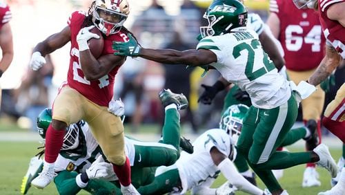 Former Georgia Tech running back Jordan Mason (left) started in place of an injured Christian McCaffrey for the 49ers in their 32-19 victory over the Jets in a Monday Night Football matchup. (AP photo/Godofredo A. Vásquez)