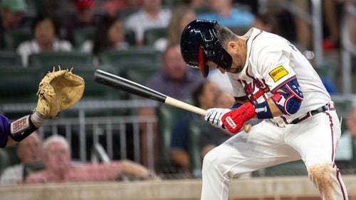 Atlanta Braves outfielder Whit Merrifield (15) is hit by a pitch from the Rockies in the seventh inning at Truist Park in Atlanta on Tuesday, September 3, 2024. (Arvin Temkar / AJC)