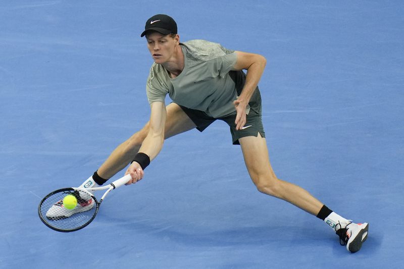 Jannik Sinner of Italy returns a shot from Carlos Alcaraz of Spain during their men's singles finals match of the China Open tennis tournament, at the National Tennis Center in Beijing, Wednesday, Oct. 2, 2024. (AP Photo/Andy Wong)