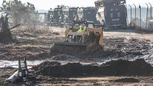 Law enforcement and construction crews were seen Monday Feb. 6, 2023 at the site of Atlanta’s proposed public safety training center in anticipation of construction beginning on the controversial facility. From The Atlanta Journal-Constitution. (John Spink / John.Spink@ajc.com)