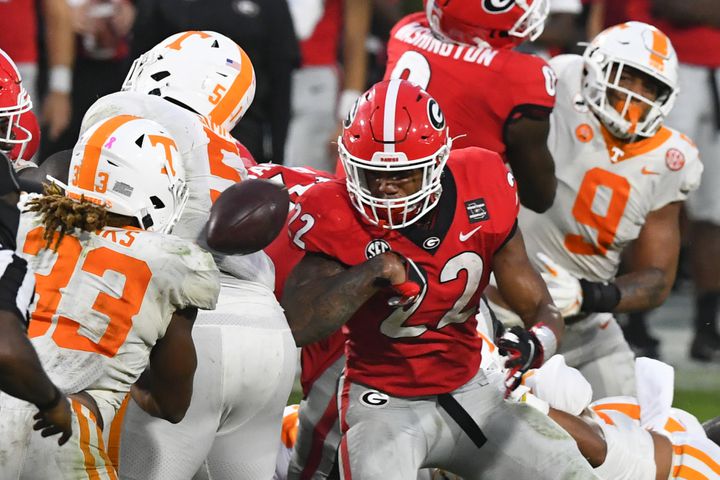 Georgia running back Kendall Milton (22) fumbles while rushing against Tennessee during the second half of a football game Saturday, Oct. 10, 2020, at Sanford Stadium in Athens. Georgia won 44-21. JOHN AMIS FOR THE ATLANTA JOURNAL- CONSTITUTION