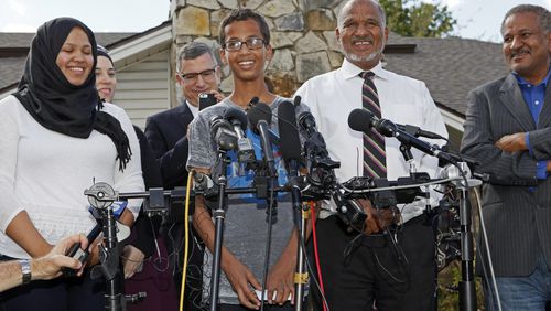 IRVING, TX - SEPTEMBER 16: 14-year-old Ahmed Ahmed Mohamed, surrounded by his family, speaks during a news conference on September 16, 2015 in Irving, Texas. Mohammed was detained after a high school teacher falsely concluded that a homemade clock he brought to class might be a bomb. The news converence, held outside the Mohammed family home, was hosted by the North Texas Chapter of the Council on American-Islamic Relations. (Photo by Ben Torres/Getty Images)