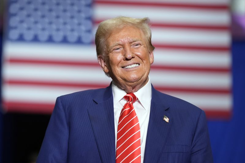 Republican presidential nominee former President Donald Trump smiles as he speaks at a campaign event, Friday, Aug. 30, 2024, in Johnstown, Pa. (AP Photo/Alex Brandon)