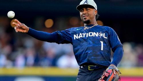 National League's Ozzie Albies, of the Atlanta Braves, throws during the MLB All-Star baseball game against the American League in Seattle, Tuesday, July 11, 2023. (AP Photo/Lindsey Wasson)