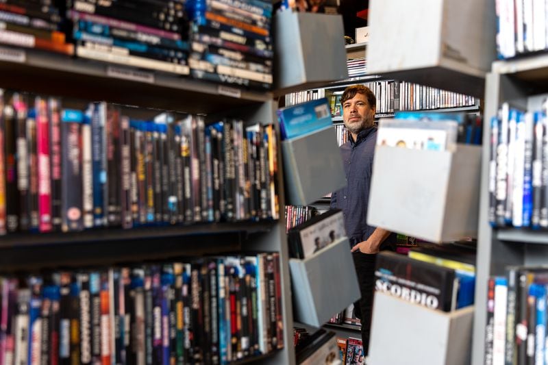 Videodrome owner Matt Booth poses for a portrait at the video rental store in Atlanta on Thursday, June 22, 2023. (Arvin Temkar / arvin.temkar@ajc.com)