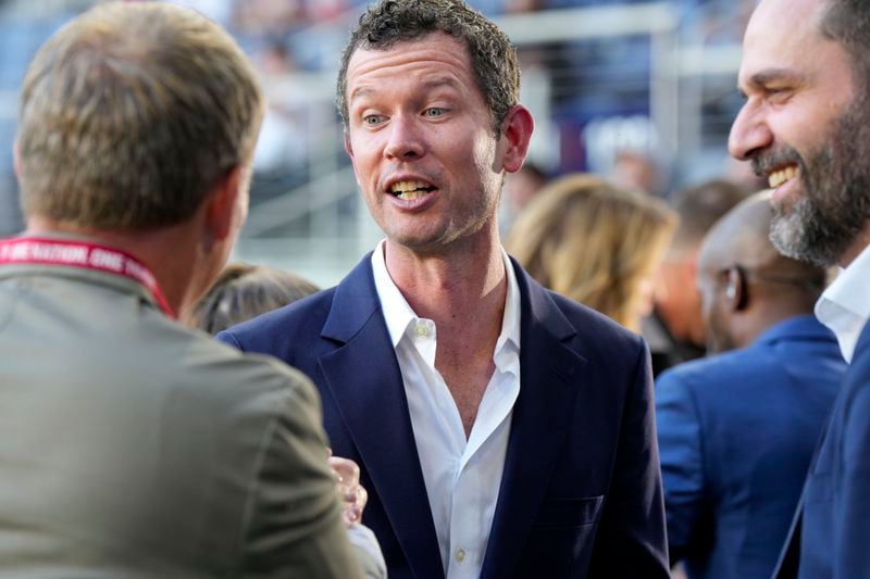 United States CEO JT Batson, center, speaks with sporting director Matt Crocker, left, prior to a friendly soccer match against New Zealand, Tuesday, Sept. 10, 2024, in Cincinnati. (AP Photo/Jeff Dean)