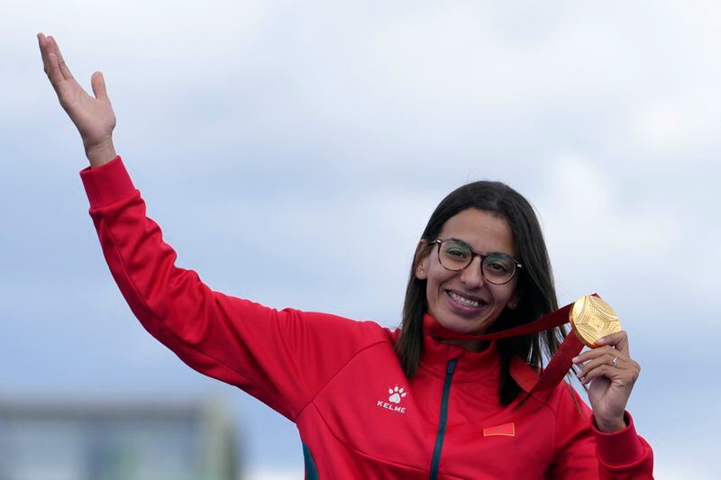 Morocco's Fatima Ezzahra El Idrissi poses with her gold medal after winning the women's marathon T12 at the 2024 Paralympics, Sunday, Sept. 8, 2024, in Paris, France. (AP Photo/Thibault Camus)