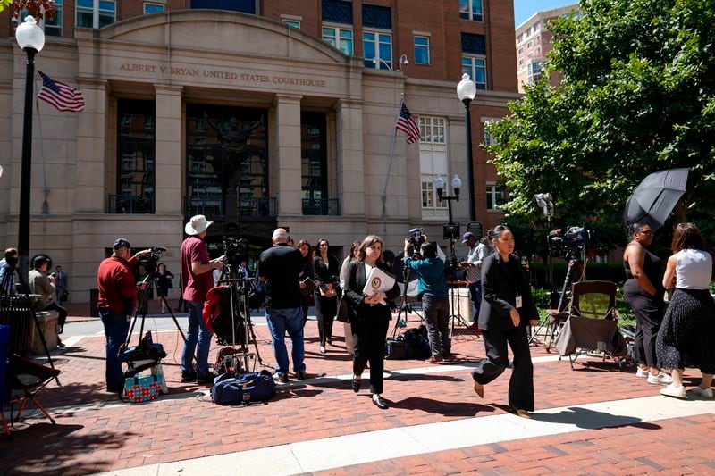 Lawyers and legal assistants leave the U.S. District Court for the Eastern District of Virginia for a lunch break in the Department of Justice's antitrust trial against tech giant Google, Monday, Sept. 9, 2024, in Alexandria, Va. (AP Photo/Stephanie Scarbrough)