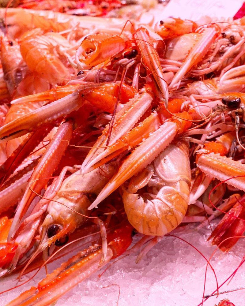 A stall at La Boqueria food market in Barcelona, Spain, sells fresh shrimp, an ingredient often found in paella. CONTRIBUTED BY ASHA GOMEZ