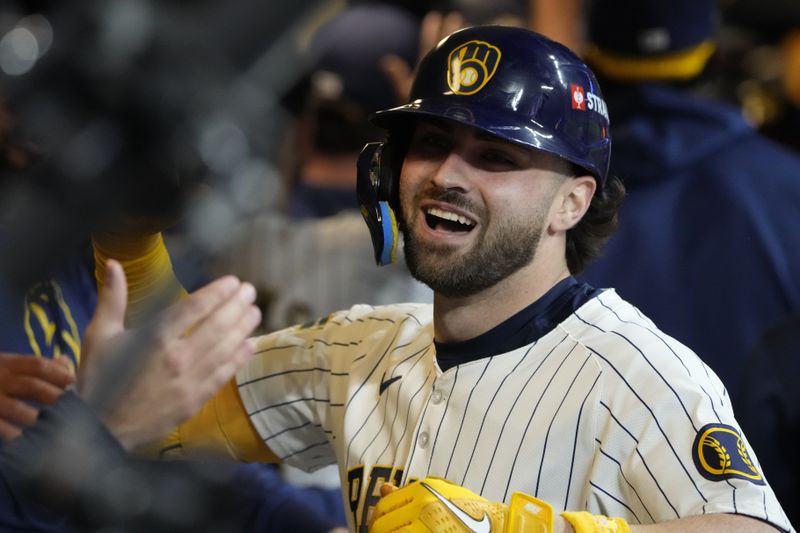 Milwaukee Brewers' Garrett Mitchell celebrates afrer hitting a two-run home run during the eighth inning of Game 2 of a National League wild card baseball game against the New York Mets Wednesday, Oct. 2, 2024, in Milwaukee. (AP Photo/Morry Gash)