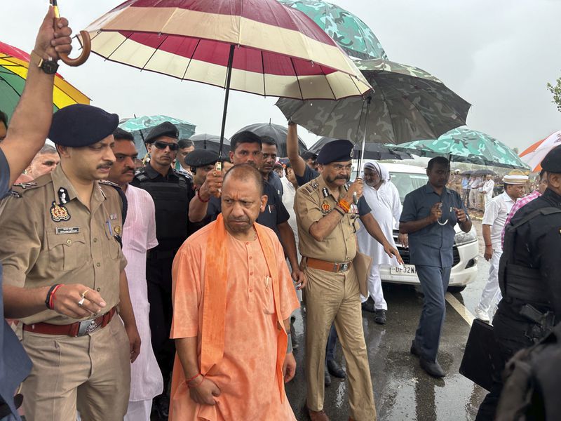 Uttar Pradesh State Chief Minister Yogi Adityanath visits the place where a fatal stampede took place in Fulrai village of Hathras district, Uttar Pradesh, India, Wednesday, July 3, 2024. Thousands of people at a religious gathering rushed to leave a makeshift tent, setting off a stampede Tuesday that killed more than hundred people and injured scores. (AP Photo/Rajesh Kumar Singh)
