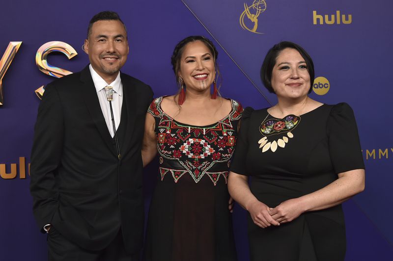 James Johnson, from left, Princess Daazhraii Johnson, and Cathy Tagnak Rexford arrive at the 76th Primetime Emmy Awards on Sunday, Sept. 15, 2024, at the Peacock Theater in Los Angeles. (Photo by Richard Shotwell/Invision/AP)