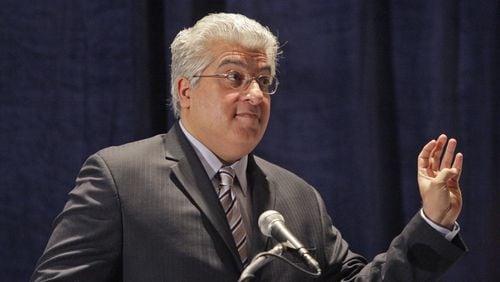 Rajeev Dhawan, director of the Economic Forecasting Center at Georgia State University, speaks during the center's quarterly conference in June 2020. (Bob Andres/AJC)