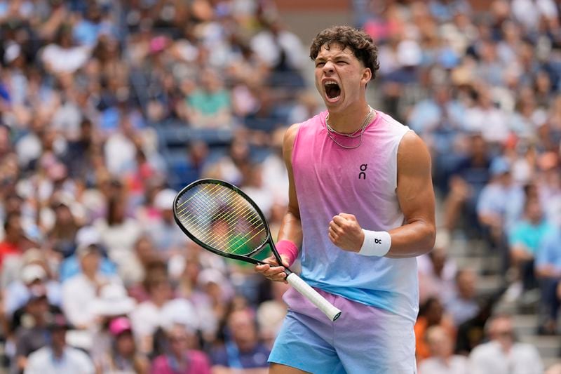 Ben Shelton, of the United States, reacts after scoring a point against Frances Tiafoe, of the United States, during the third round of the U.S. Open tennis championships, Friday, Aug. 30, 2024, in New York. (AP Photo/Seth Wenig)