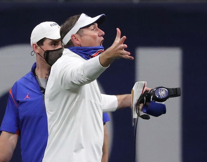 Florida coach Dan Mullen argues a unsportsmanlike-conduct penalty call against Florida during the fourth quarter of the SEC Championship game Saturday, Dec. 19, 2020, against Alabama at Mercedes-Benz Stadium in Atlanta. (Curtis Compton / Curtis.Compton@ajc.com)