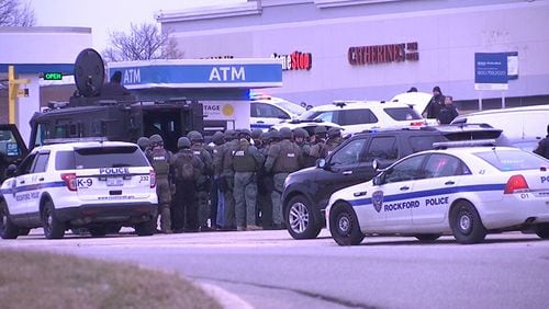 A SWAT team is seen outside the Heritage Credit Union in Rockford, Illinois, Friday, after a bank robbery turned into a hostage crisis, according to reports.