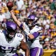 Minnesota Vikings quarterback Sam Darnold (14) throws a pass during the first half of an NFL football game against the Green Bay Packers, Sunday, Sept. 29, 2024, in Green Bay, Wis. (AP Photo/Morry Gash)