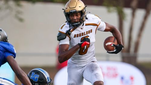 Douglass defensive back/wide receiver Jontae Gilbert (0) runs after a catch against LaGrange in the Corky Kell Dave Hunter Classic at Kell High School, Wednesday, August 14, 2024, in Marietta, Ga. Douglass won 18-3. Jontae Gilbert is a 2025 Georgia football verbal commit. (Jason Getz / AJC)
