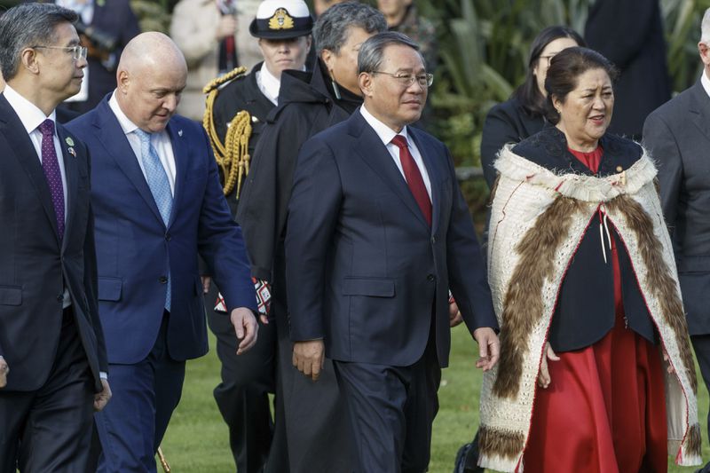 Chinese Premier Li Qiang, centre, stands with New Zealand Prime Minister Christopher Luxon, second left, and New Zealand Governor General Dame Cyndi Kiro, right, during the official welcome ceremony in Wellington, New Zealand, Thursday, June 13, 2024. Li has arrived in New Zealand at the start of a weeklong tour that also includes Australia and Malaysia. (Mark Mitchell/NZ Herald via AP)