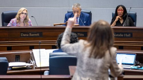 A person comments in support of Republican Jason Frazier during the public comment portion of the Fulton County Board of Commissioners meeting Wednesday in Atlanta. The board rejected the nomination of Frazier, who has challenged the registrations of nearly 10,000 voters, as a member of the county election board. (Arvin Temkar / arvin.temkar@ajc.com)