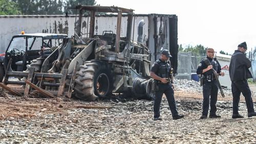Atlanta police and construction personnel were on the construction site of the police training center on March 6, 2023 in Atlanta examining equipment set on fire and destroyed by protests. (John Spink / John.Spink@ajc.com)