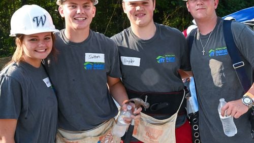 Sutton Cadman, second from left, gathers with other students on Day 1 of the Habitat for Humanity house build in Douglasville. Sutton started a Habitat for Humanity chapter at Alexander High School, and led students in raising funds to build a house for a veteran. Also pictured from left, founding chapter member Mylee Ward, and Sutton's friends, Hayden Arnold and Mason Villa from other schools. Courtesy of Dolly Purvis for Habitat for Humanity of Northwest Metro Atlanta