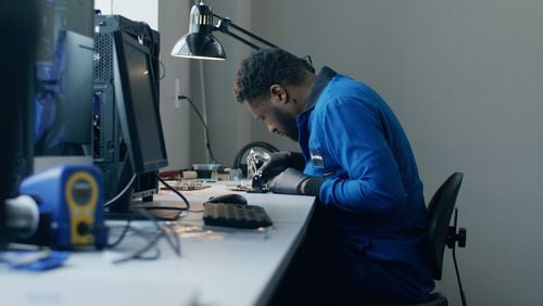 Craig Green, chief technology officer for Carbice, working in Atlanta lab. The company is hiring engineers.