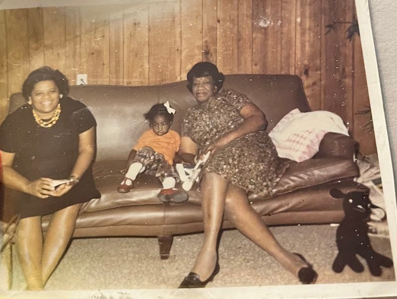 A young Angela Farris Watkins snuggles with her grandmother, Alberta King, whom she called Big Mama.
