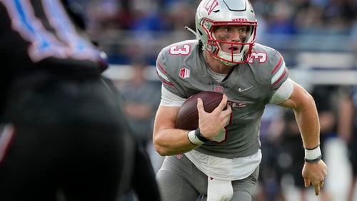 UNLV quarterback Matthew Sluka runs with the ball in the first half against Kansas during an NCAA college football game Friday, Sept. 13, 2024, at Children's Mercy Park in Kansas City, Kan. (AP Photo/Ed Zurga)