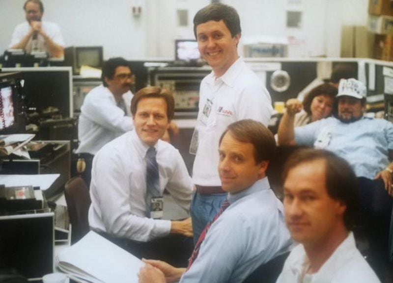 Jon Shirek (left) with John Pruitt (seated, center) at 11Alive in the newsroom sometime in the 1980s. CONTRIBUTED