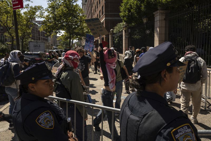 Pro-Palestinian supporters hold picket line outside Barnard College, Tuesday, Sept. 3, 2024, in New York. (AP Photo/Yuki Iwamura)