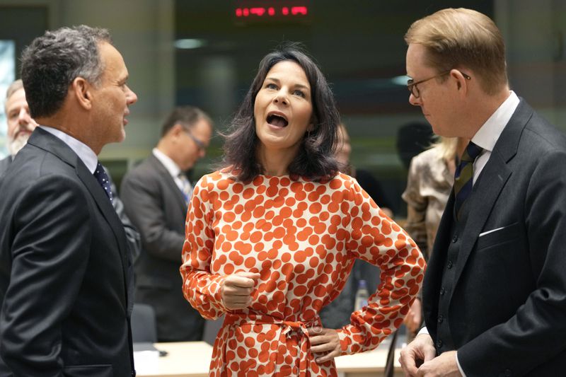 Germany's Foreign Minister Annalena Baerbock, center, speaks with Netherlands' Foreign Minister Caspar Veldkamp, left, and Sweden's Foreign Minister Tobias Billstrom during a meeting of EU foreign ministers at the European Council building in Brussels, Thursday, Aug. 29, 2024. (AP Photo/Virginia Mayo)