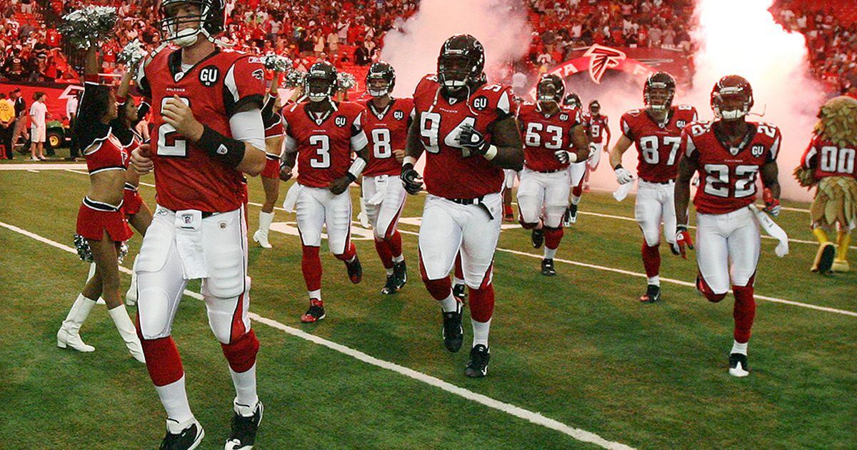 Quarterback Michael Vick of the Atlanta Falcons delivers a pass