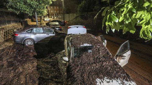 At Clark Atlanta University, so much mud was left behind from a fierce rainstorm on Sept. 14 that it looked like a dirt road as flooded cars remained after the water receded the following morning. According to city officials, rain gauges show that about three hours’ worth of rain came down in just 15 minutes in some areas of downtown Atlanta, flooding many areas including the campus. (John Spink / John.Spink@ajc.com)