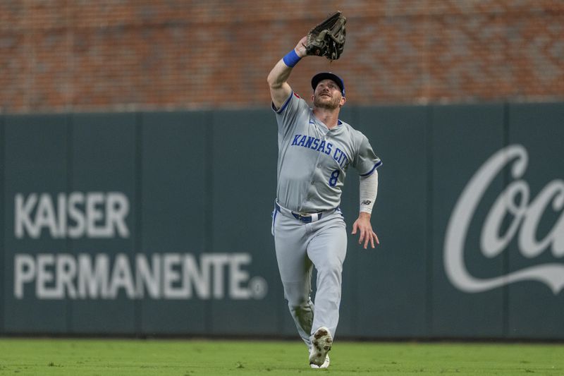 Kansas City Royals outfielder Robbie Grossman catches a pop fly hit by Atlanta Braves' Matt Olson in the fourth inning of a baseball game, Saturday, Sept. 28, 2024, in Atlanta. (AP Photo/Jason Allen)