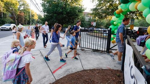 Parents and students arrive for the first day of school at Springdale Park Elementary School in Atlanta on Tuesday, Aug. 1, 2023.   (Bob Andres for the Atlanta Journal Constitution)