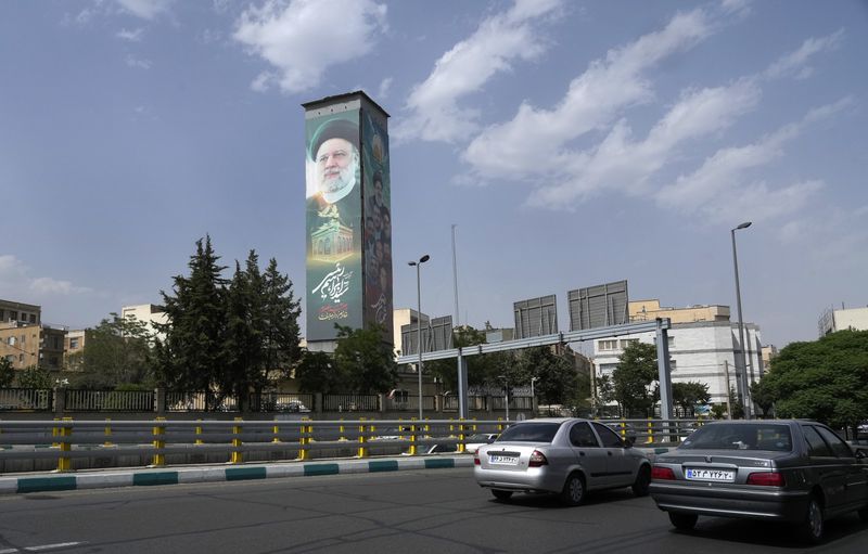 Cars drive past a huge billboard showing the late Iranian President Ebrahim Raisi on a highway in Tehran, Iran, Saturday, June 29, 2024. Iran will hold a runoff presidential election on July 5 to replace the late hard-line President Ebrahim Raisi after an initial vote saw the top candidates not secure an outright win in the lowest turnout poll ever held in the Islamic Republic by percentage. (AP Photo/Vahid Salemi)