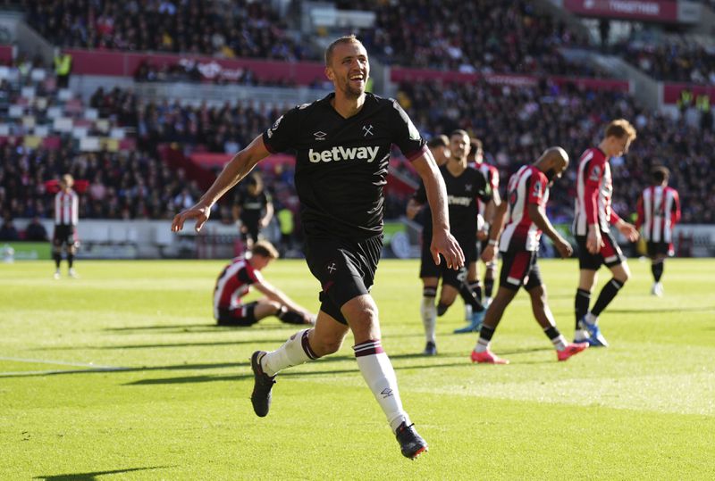 West Ham United's Tomas Soucek celebrates scoring his side's first goal of the game during the British Premier League soccer match between West Ham and Brentford, at the Gtech Community Stadium, London, Saturday Sept. 28, 2024. (John Walton/PA via AP)