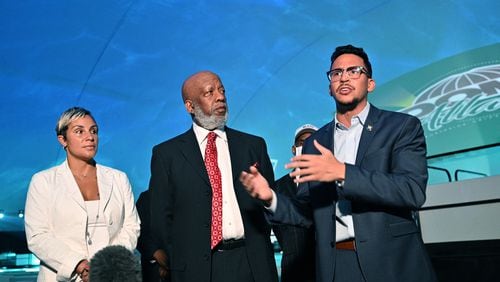 Atlanta City Councilman Antonio Brown (right) speaks to members of the press as Michelle Falconer (left) and Bishop John Lewis, chairman of the Vine City Civic Association, look during a press conference Inside Dome Atlanta across the street from the Mercedes-Benz Stadium on Tuesday, May 25, 2021. (Hyosub Shin / Hyosub.Shin@ajc.com)