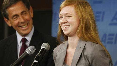 Abigail Fisher, who sued the University of Texas when she was not offered a spot at the university’s flagship Austin campus in 2008, with Edward Blum of the Project on Fair Representation, speaks at a news conference at the American Enterprise Institute in Washington on Monday. The U.S. Supreme Court ruling on affirmative action in higher education will have “no impact” on the University of Texas’ admissions policy, school president Bill Powers said Monday, noting UT will continue to use race as a factor in some cases.