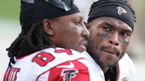 CHARLOTTE: Falcons wide receivers Roddy White and Julio Jones confer on the bench during a 38-0 loss to the Panthers in a football game on Sunday, Dec. 13, 2015, in Charlotte. Curtis Compton / ccompton@ajc.com