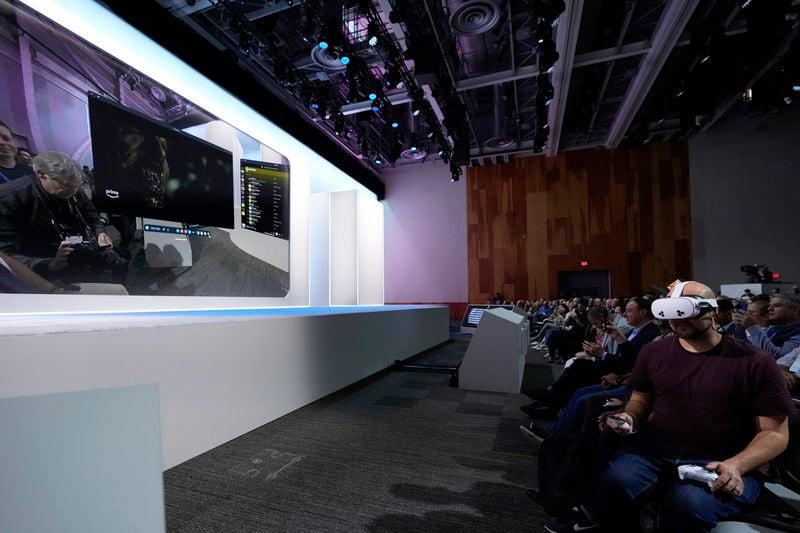 A person demonstrates the Meta Quest 3S during the Meta Connect conference Wednesday, Sept. 25, 2024, in Menlo Park, Calif. (AP Photo/Godofredo A. Vásquez)