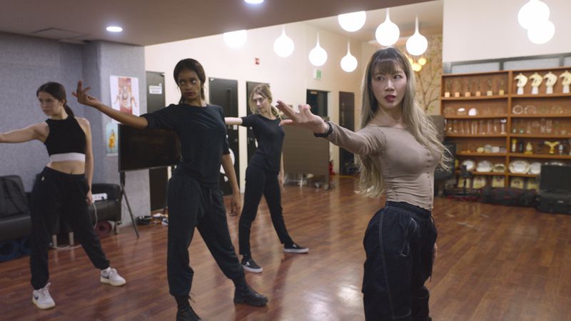 In this undated photo provided by AppleTV+, K-pop band Blackswan members practice a routine. (AppleTV+ via AP)