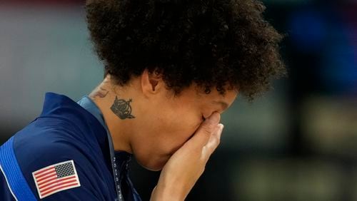 United States' Brittney Griner wipes a tear after a women's gold medal basketball game at Bercy Arena at the 2024 Summer Olympics, Sunday, Aug. 11, 2024, in Paris, France. (AP Photo/Mark J. Terrill)